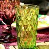 Glas Wasserglas Highgate Long Bunt 01 dekoriert auf gedecktem Tisch
